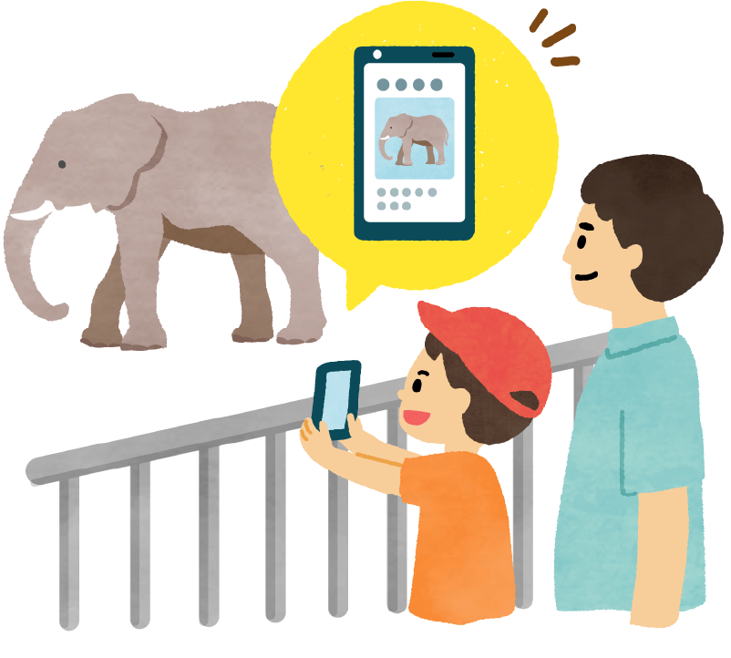 スマホアプリ「ナニコレンズ」を使って、動物園の動物の写真を撮る親子